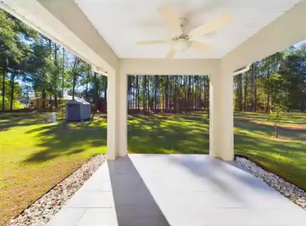 5208 Southwest 39th Street Ocala, FL 34474 - Photo 25 of 55 a view of a house with a yard