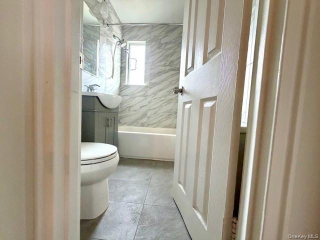 216-11 73rd Avenue, Unit DUPLEX Queens, NY 11364 - Photo 11 of 27 a bathroom with a toilet a sink and shower