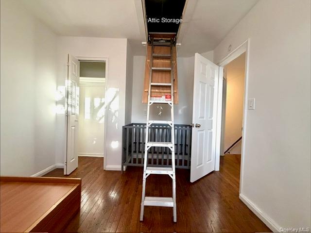 216-11 73rd Avenue, Unit DUPLEX Queens, NY 11364 - Photo 17 of 27 Bedroom with dark wood-type flooring and baseboards
