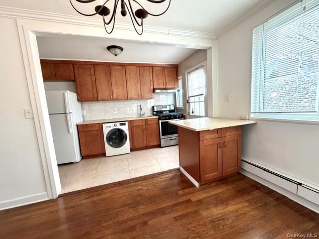 216-11 73rd Avenue, Unit DUPLEX Queens, NY 11364 - Photo 2 of 27 a kitchen with stainless steel appliances granite countertop a sink a stove a refrigerator and cabinets
