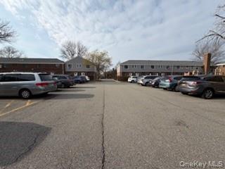 216-11 73rd Avenue, Unit DUPLEX Queens, NY 11364 - Photo 24 of 27 a view of street with parked cars