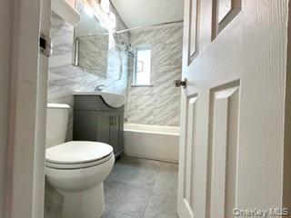 216-11 73rd Avenue, Unit DUPLEX Queens, NY 11364 - Photo 4 of 27 Full bath featuring vanity and shower / tub combo