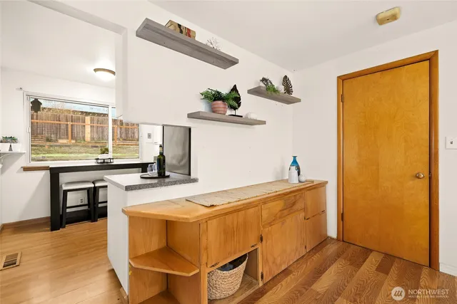 a kitchen with stainless steel appliances a stove a sink and a refrigerator