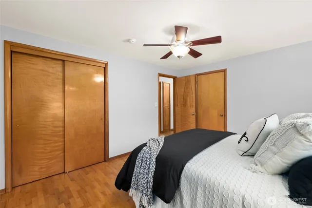 a bedroom with a bed and a chandelier