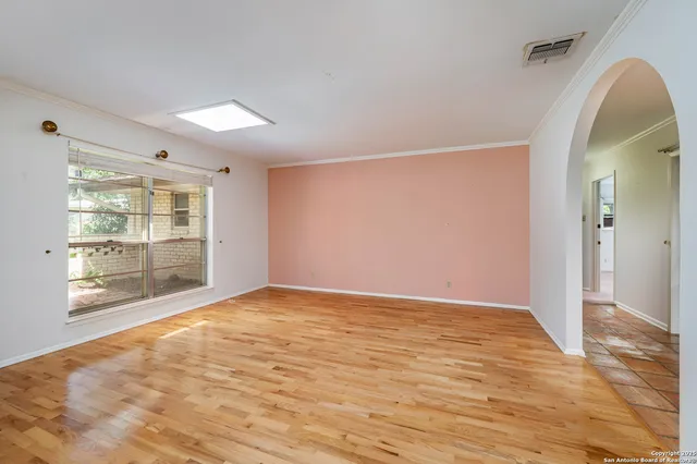 a view of an empty room and window