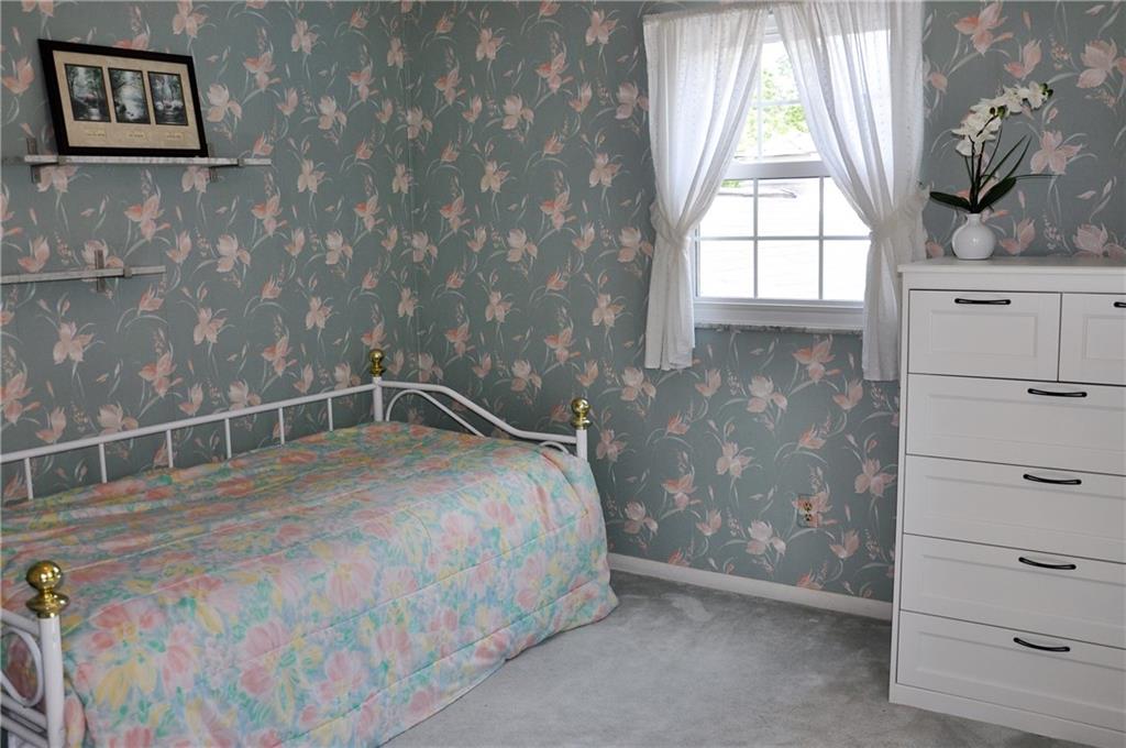 999 Old Mill Road Cheswick, PA 15024 - Photo 21 of 24 Bedroom 2 is carpeted, but has hardwood flooring under carpet.