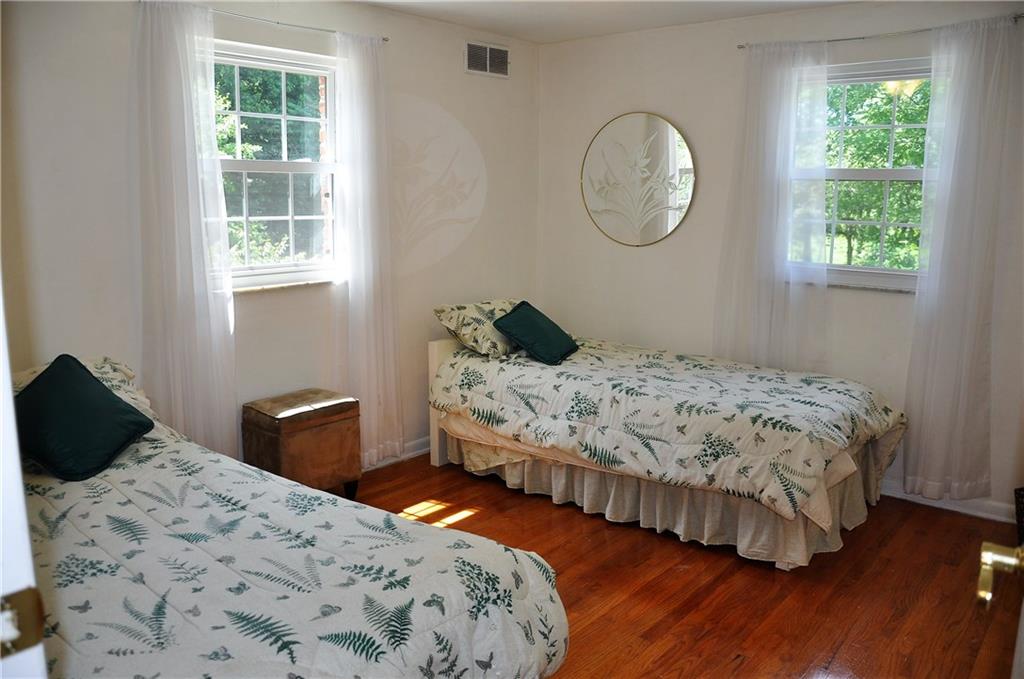 999 Old Mill Road Cheswick, PA 15024 - Photo 22 of 24 Bedroom 3 also nice and bright with hardwood flooring.