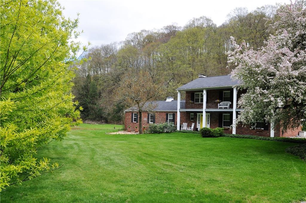 999 Old Mill Road Cheswick, PA 15024 - Photo 5 of 24 Level, lush and grand! Just waiting for you to call this one of a kind home!