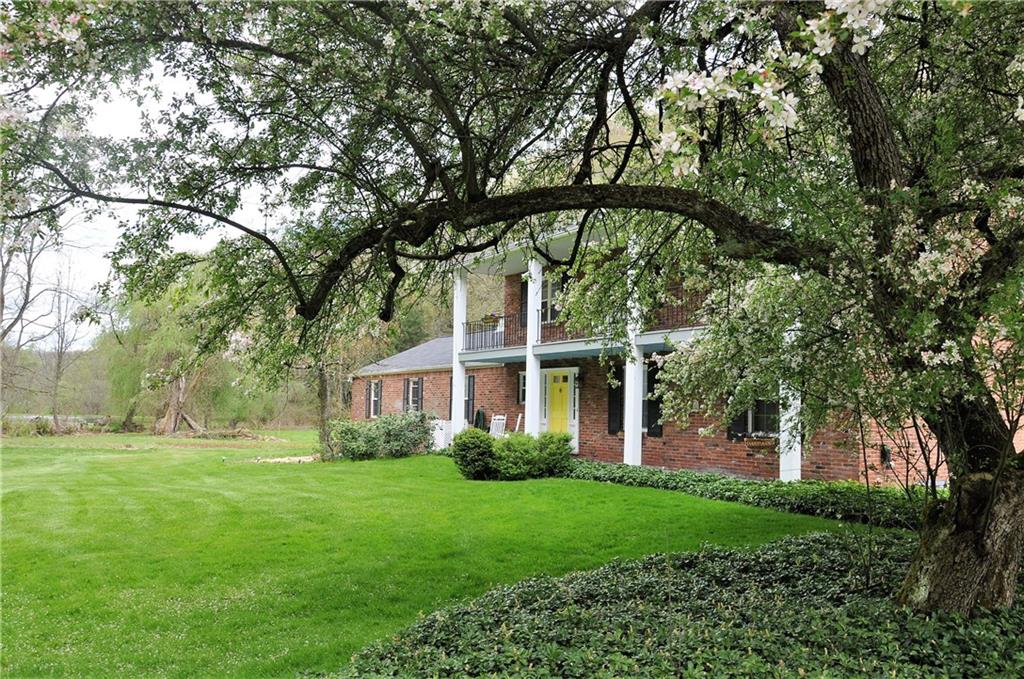 999 Old Mill Road Cheswick, PA 15024 - Photo 7 of 24 Beautiful private home with flowering trees and landscaping.