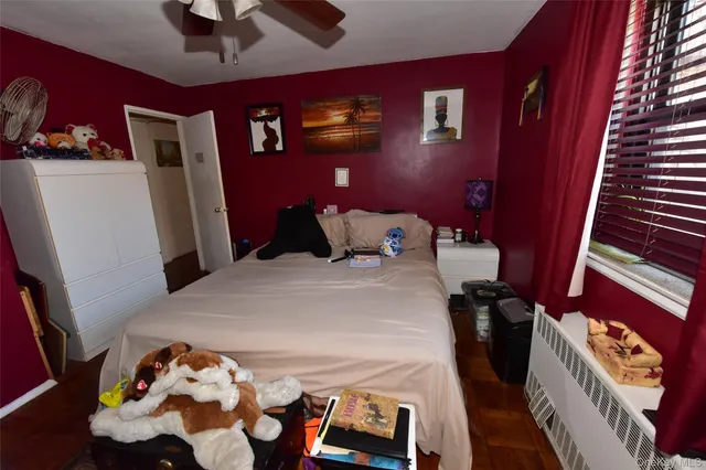 a bed room with a bed and a chair