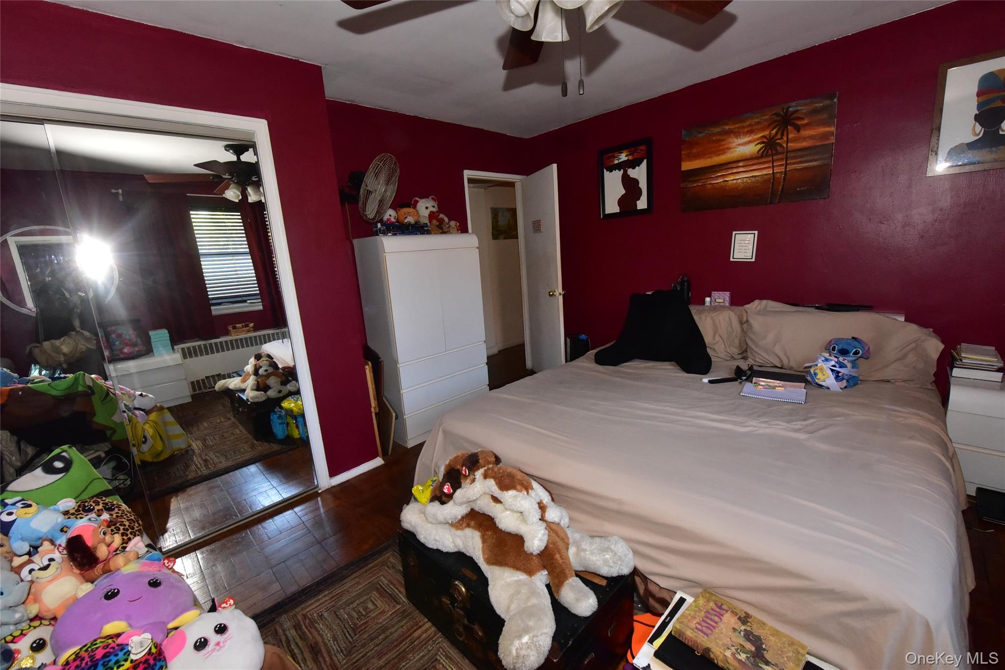 202-35 Foothill Avenue, Unit B24 Queens, NY 11423 - Photo 13 of 20 a bedroom with a bed and wooden floor