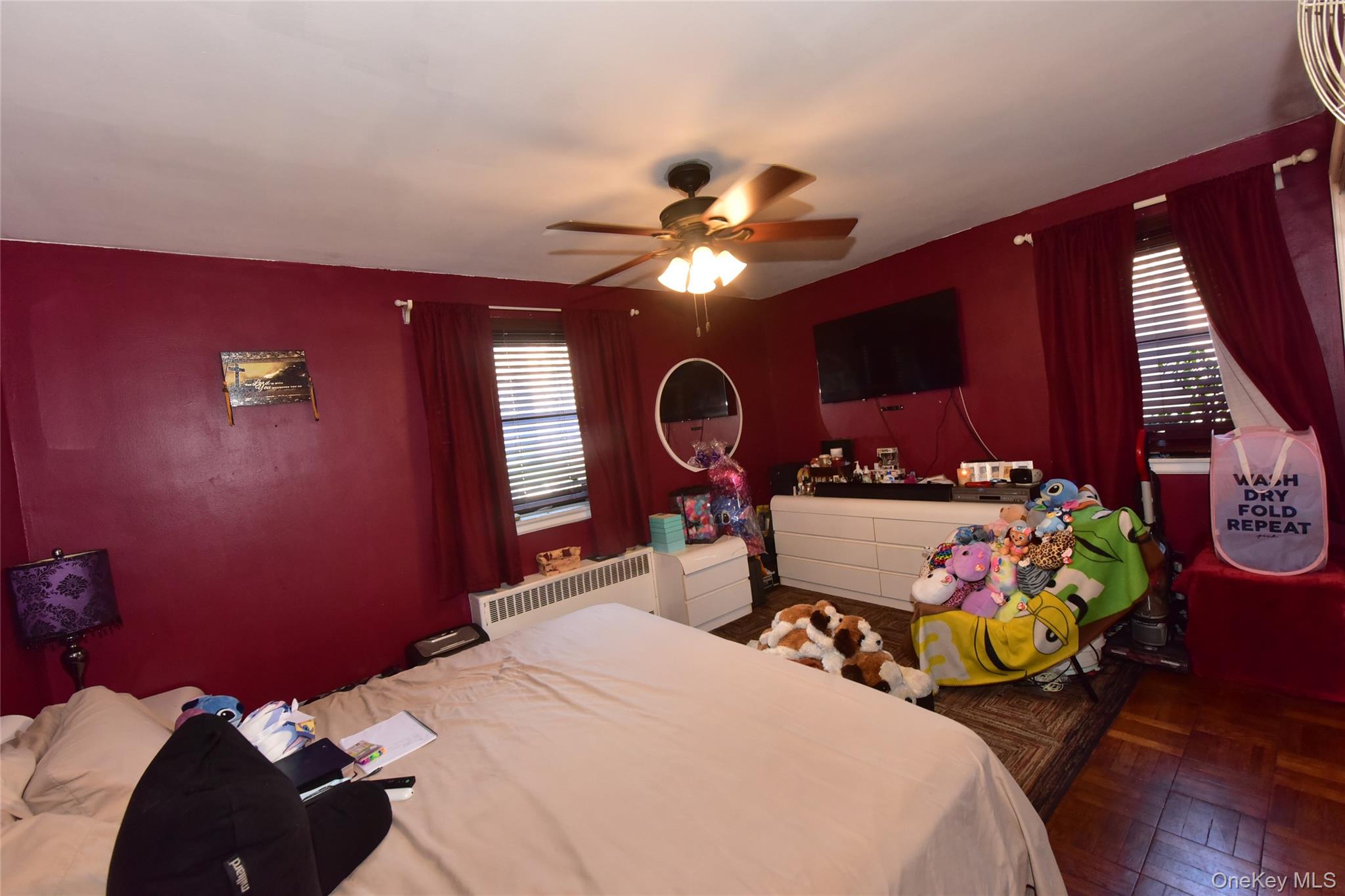 202-35 Foothill Avenue, Unit B24 Queens, NY 11423 - Photo 15 of 20 a bed room with a bed and a chair