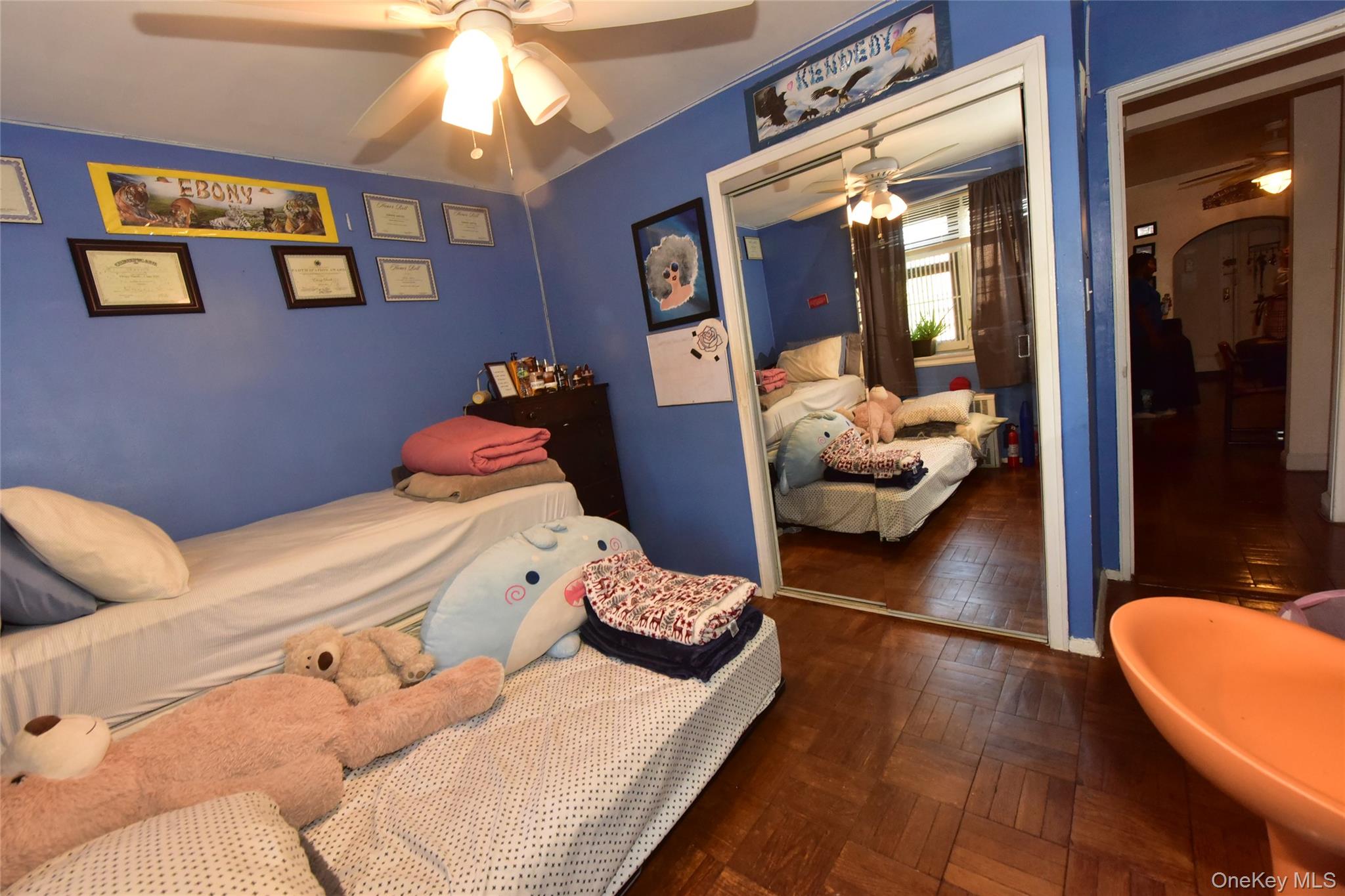 202-35 Foothill Avenue, Unit B24 Queens, NY 11423 - Photo 18 of 20 a bedroom with a bed and wooden floor