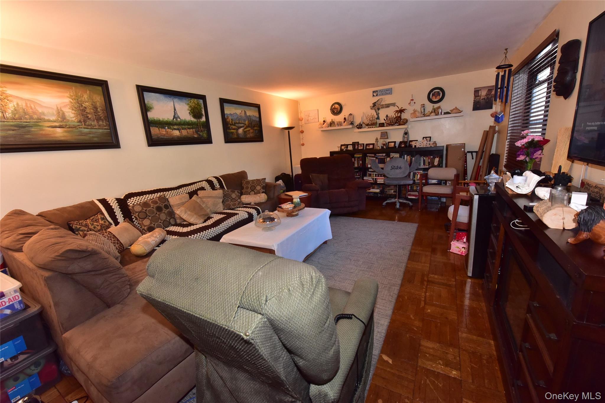 202-35 Foothill Avenue, Unit B24 Queens, NY 11423 - Photo 3 of 20 a living room with furniture and wooden floor