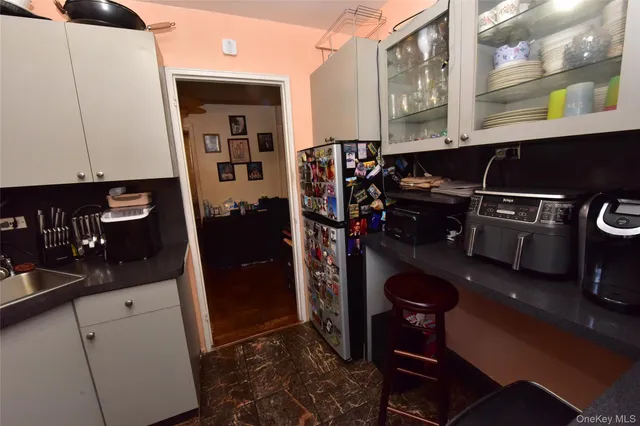 a bedroom with a bed and a mirror