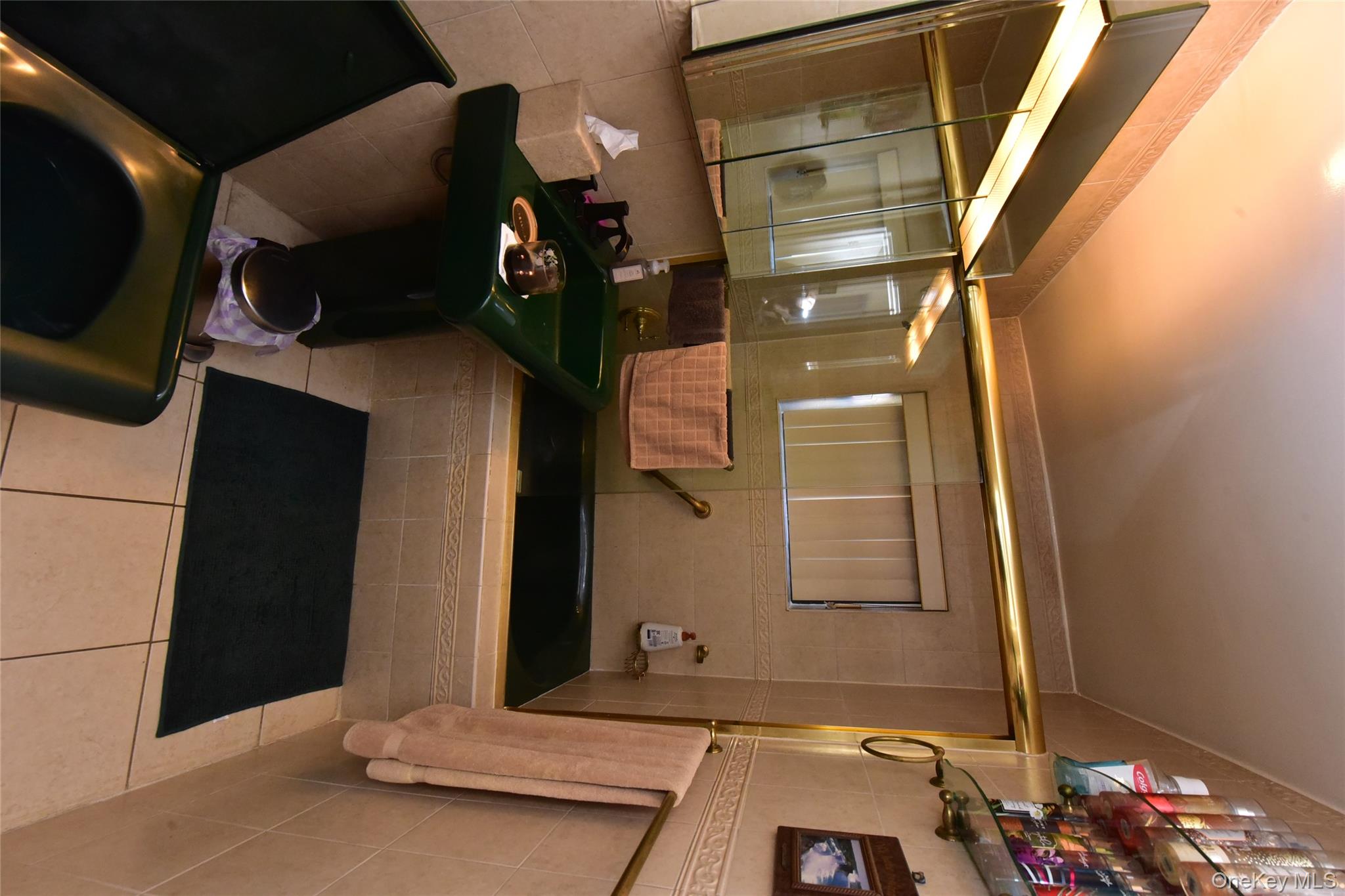 202-35 Foothill Avenue, Unit B24 Queens, NY 11423 - Photo 9 of 20 a bathroom with a sink a toilet and shower