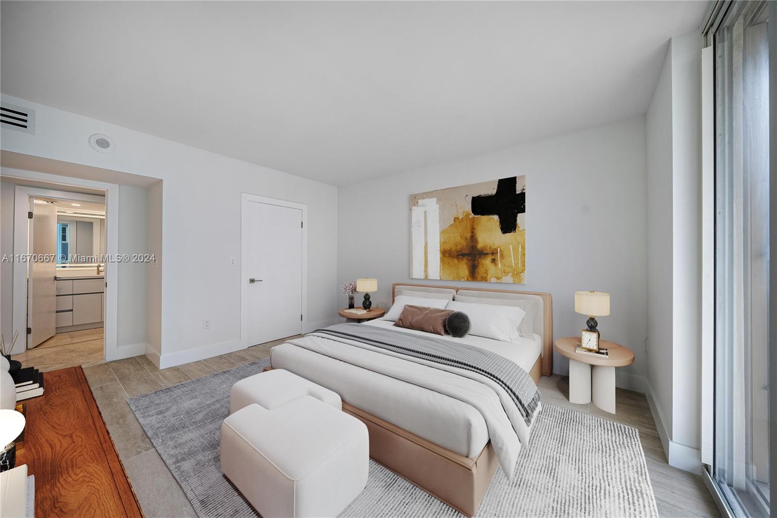 8855 Collins Avenue, Unit 5G Surfside, FL 33154 - Photo 17 of 41 a bedroom with a bed and wooden floor