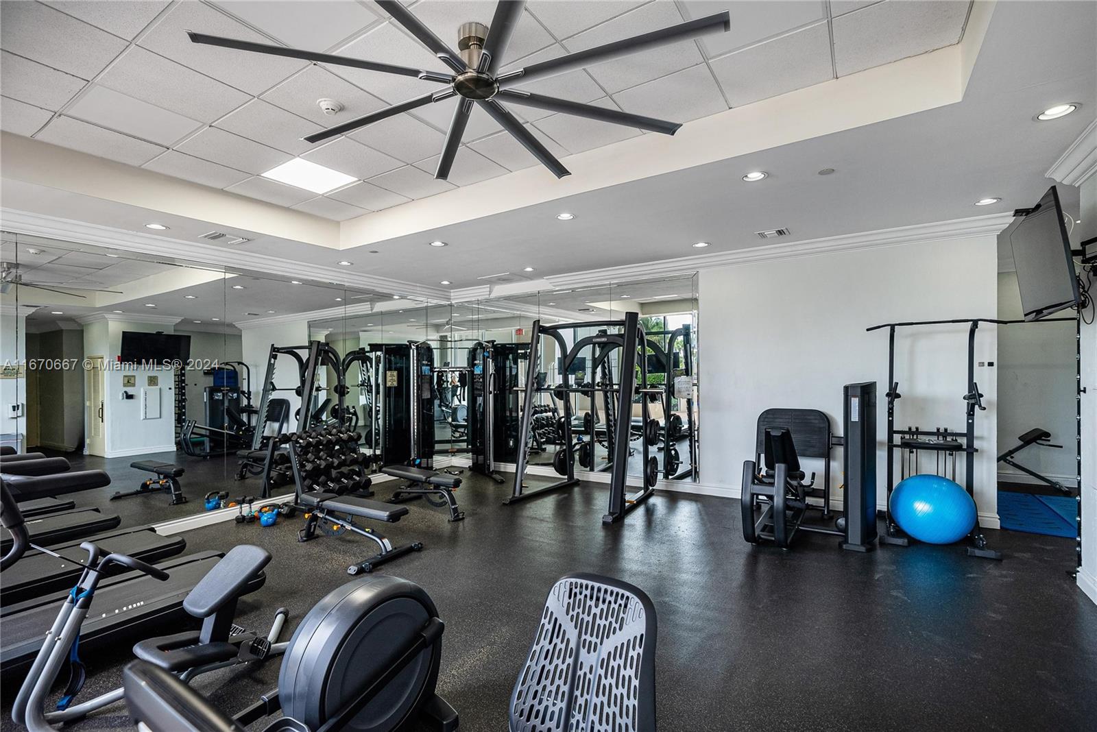 8855 Collins Avenue, Unit 5G Surfside, FL 33154 - Photo 35 of 41 a gym room with lots of gym equipment
