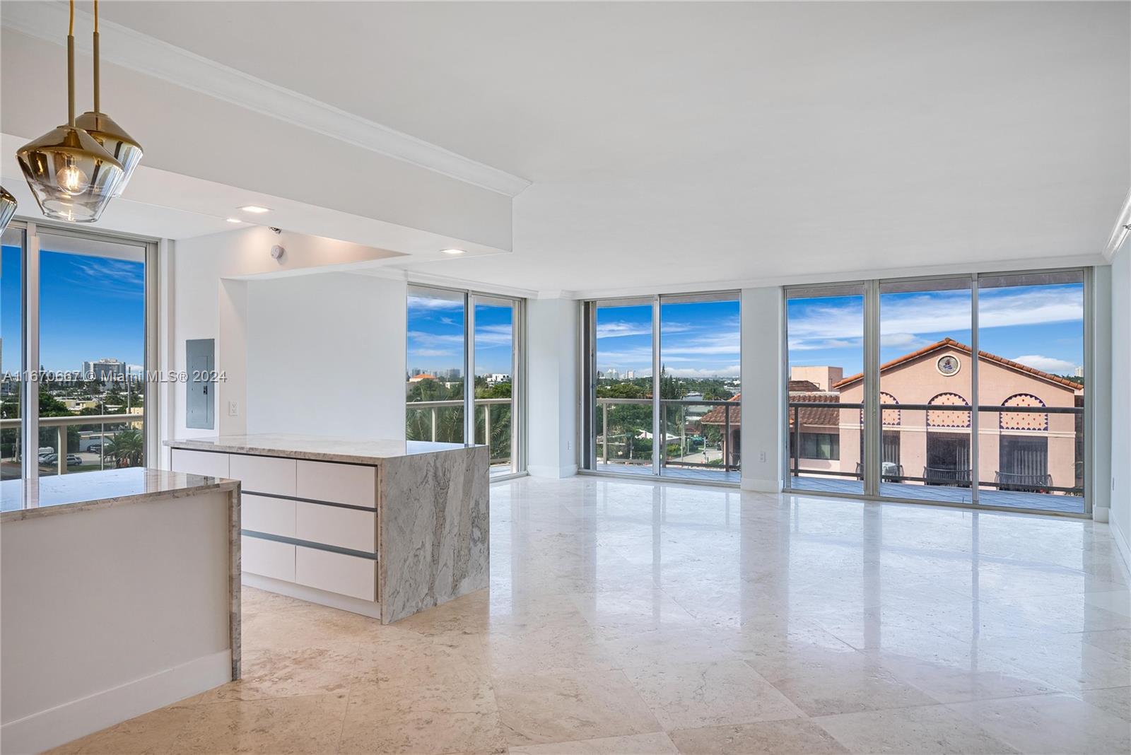 8855 Collins Avenue, Unit 5G Surfside, FL 33154 - Photo 6 of 41 a living room with furniture and a large window