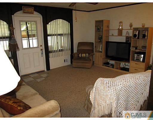 19 Wellesley Road Old Bridge, NJ 08859 - Photo 11 of 25 a bedroom with a bed and flat screen tv