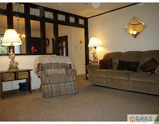 19 Wellesley Road Old Bridge, NJ 08859 - Photo 12 of 25 a living room with furniture and a large window