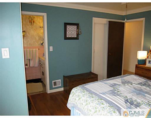 19 Wellesley Road Old Bridge, NJ 08859 - Photo 16 of 25 a bedroom with a bed and a view of bathroom