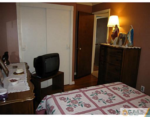 19 Wellesley Road Old Bridge, NJ 08859 - Photo 19 of 25 a bedroom with a bed and furniture