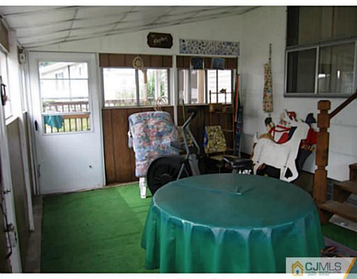 19 Wellesley Road Old Bridge, NJ 08859 - Photo 20 of 25 a living room with furniture and a flat screen tv