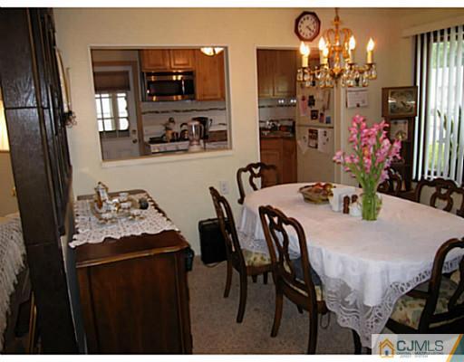 19 Wellesley Road Old Bridge, NJ 08859 - Photo 7 of 25 a dining room with furniture and chandelier