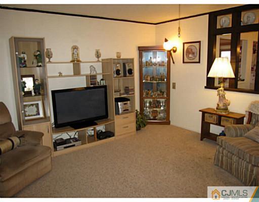 19 Wellesley Road Old Bridge, NJ 08859 - Photo 10 of 25 a view of a livingroom with workspace and a window