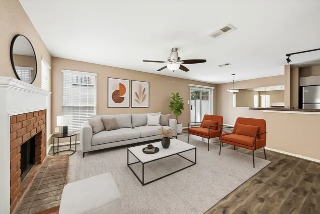 a living room with furniture and a fireplace