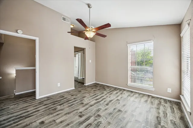 a view of an empty room with a window