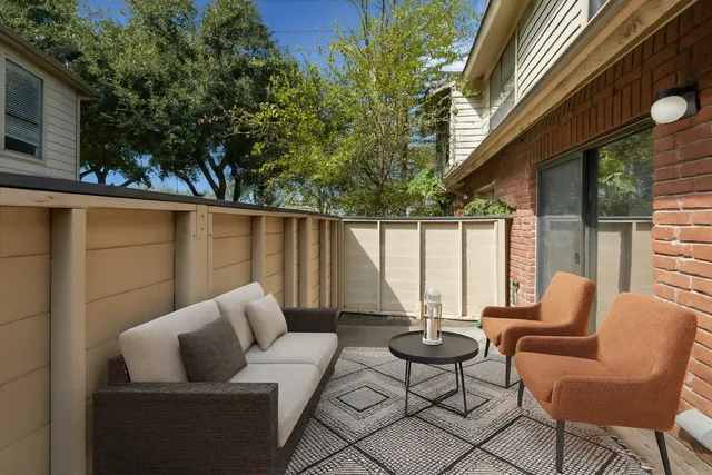 a outdoor living space with patio furniture and a potted plant