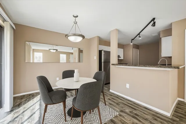 a dining room with furniture and window