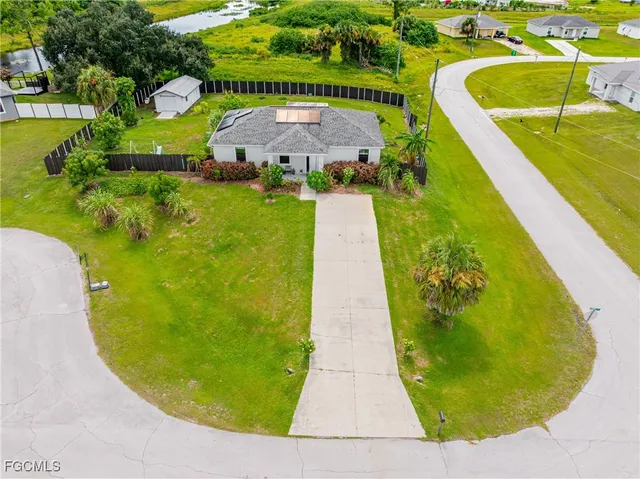 a view of a swimming pool with a yard
