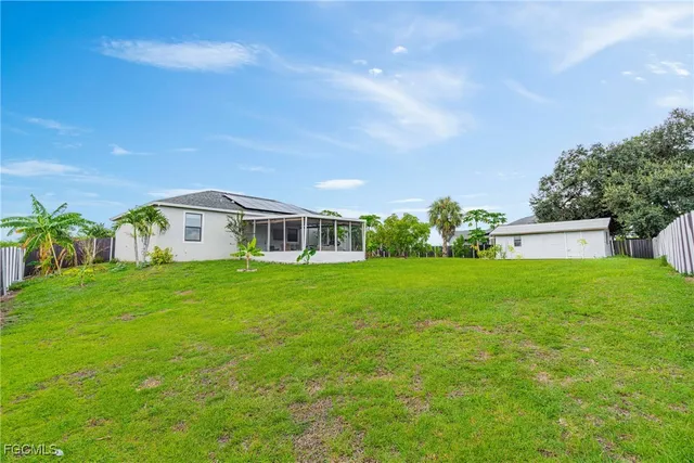 a view of a house with a big yard