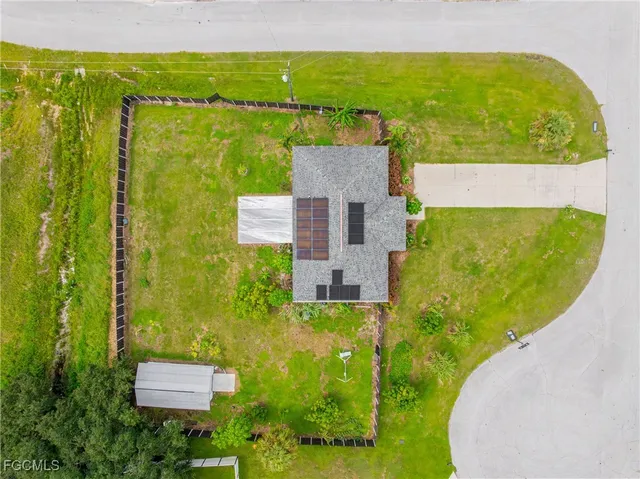 a aerial view of a house with a yard