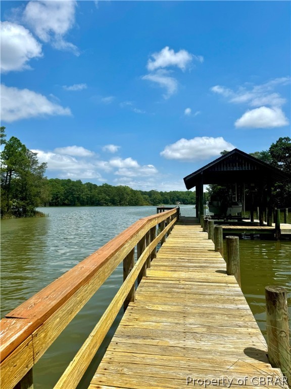 7880 Paynes Landing Road Gloucester, VA 23061 - Photo 4 of 4 Dock with a covered boat lift.