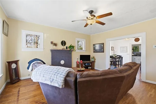 a living room with furniture and fireplace
