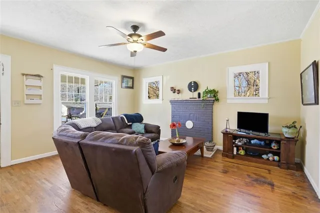 a living room with furniture and a flat screen tv