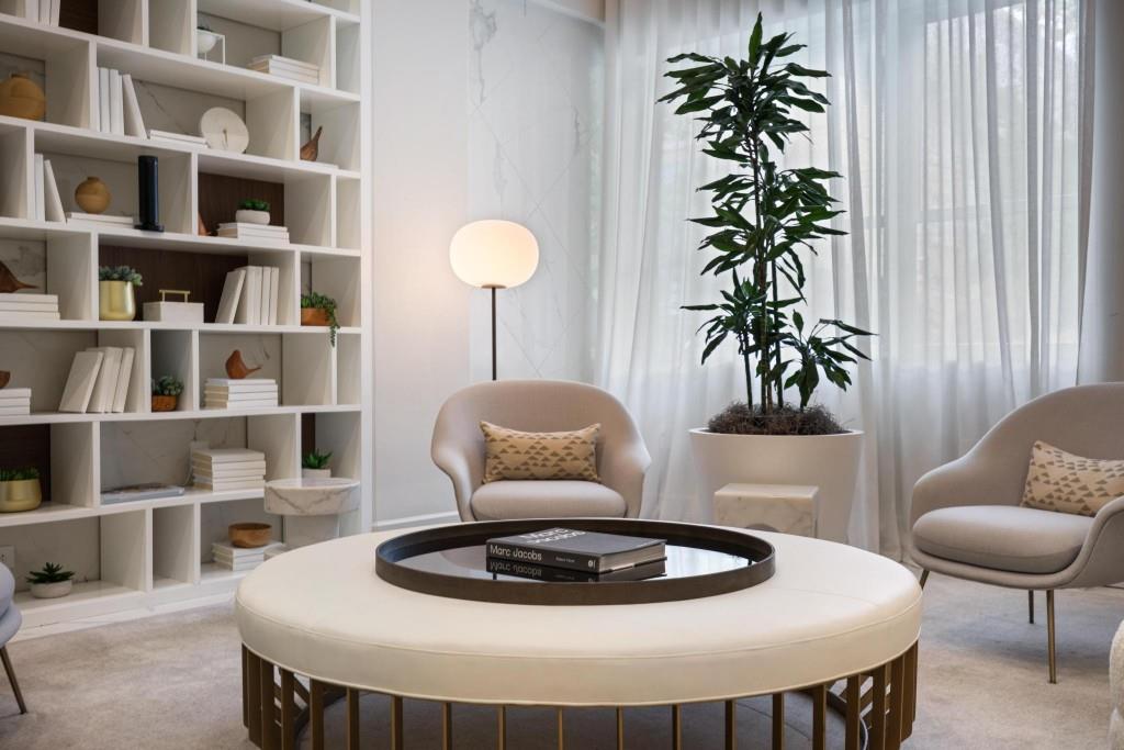 775 Juniper Street Northeast, Unit 602 Atlanta, GA 30308 - Photo 5 of 40 a living room with furniture and a potted plant