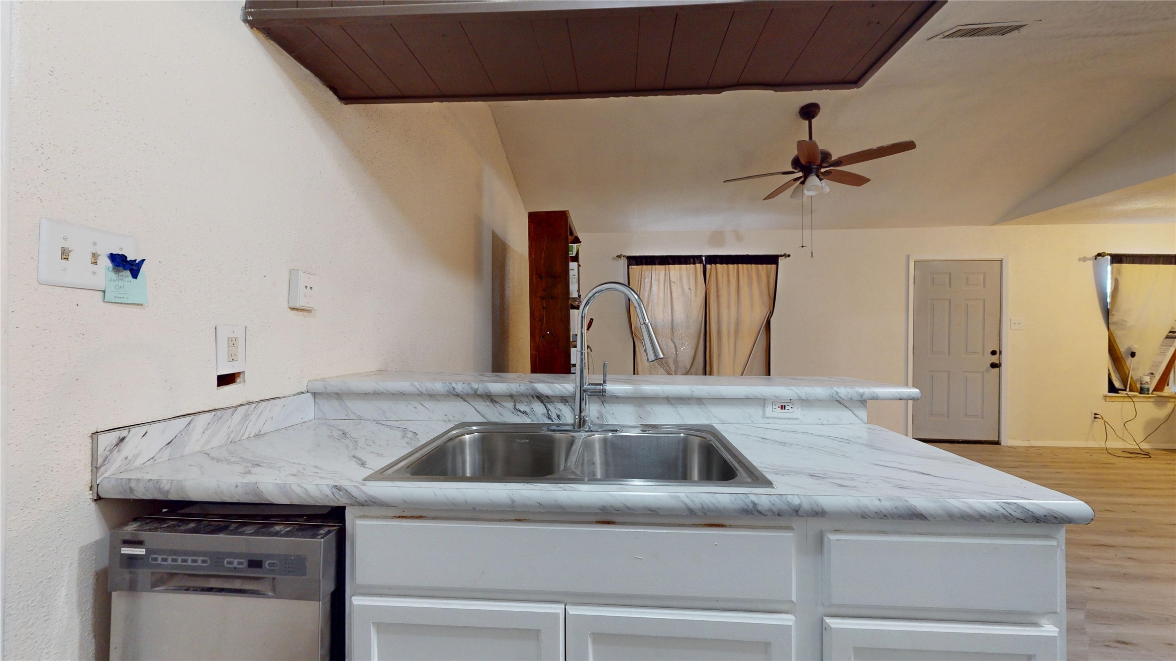 7115 Inkberry Drive Houston, TX 77092 - Photo 12 of 31 a kitchen with a sink and cabinets