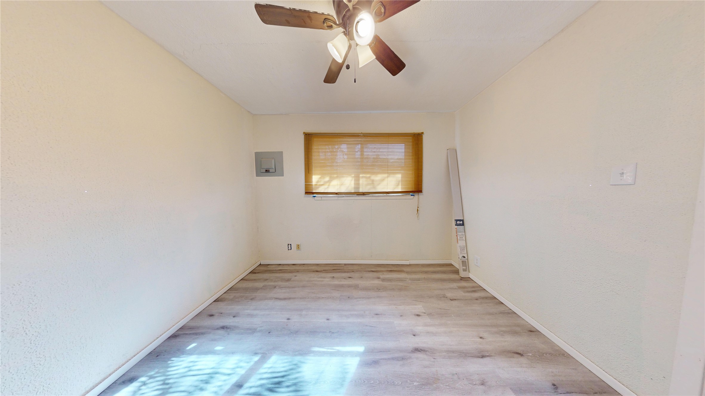 7115 Inkberry Drive Houston, TX 77092 - Photo 18 of 31 an empty room with windows and fan