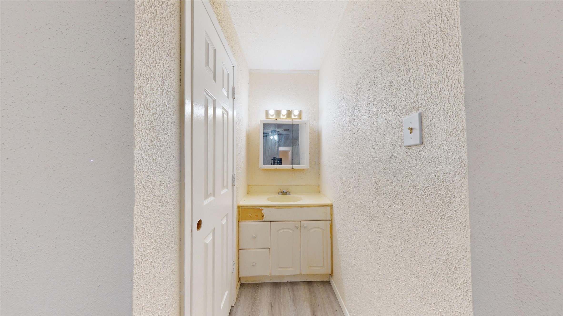 7115 Inkberry Drive Houston, TX 77092 - Photo 28 of 31 a bathroom with a sink and a mirror