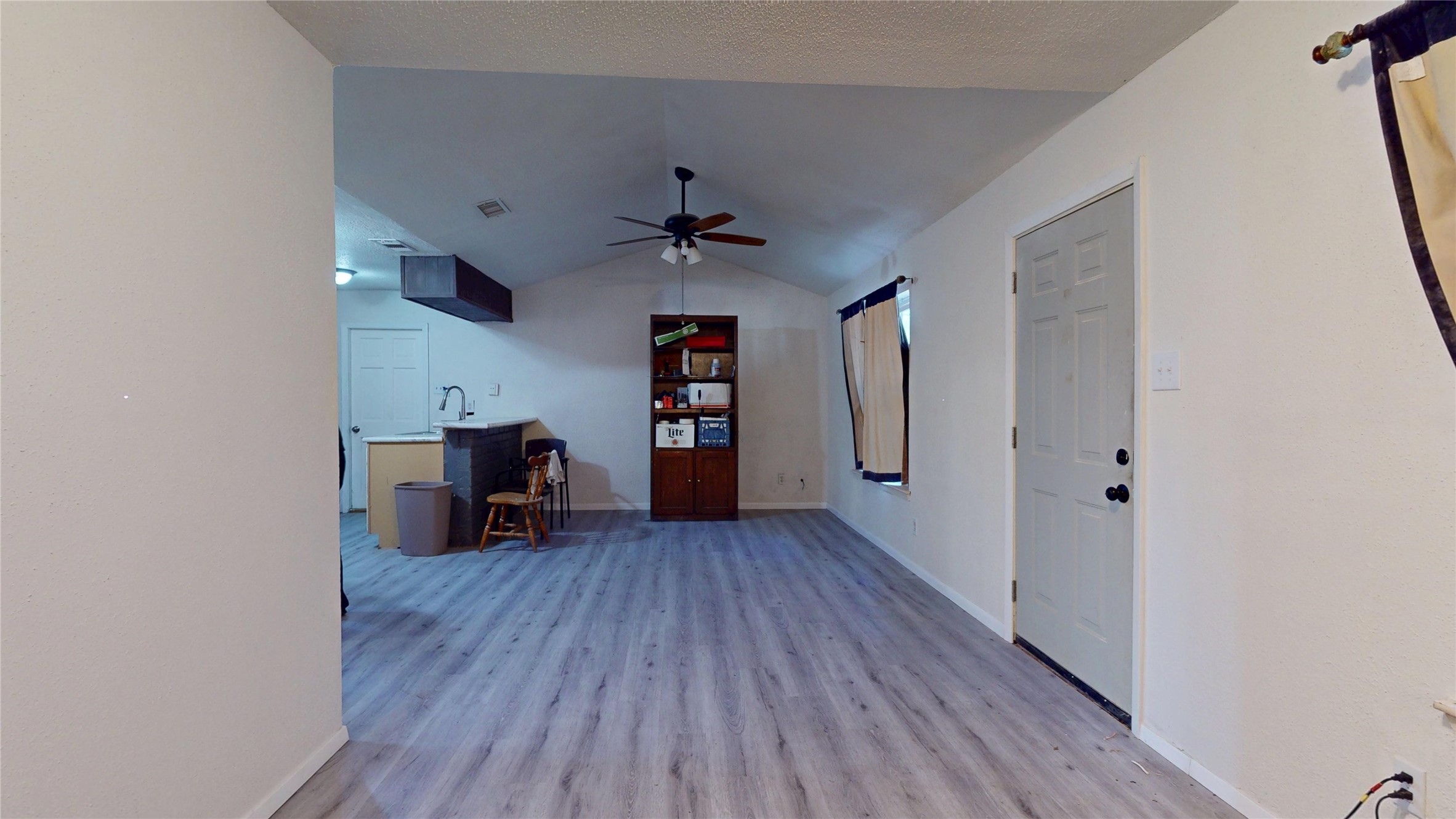 7115 Inkberry Drive Houston, TX 77092 - Photo 7 of 31 wooden floor in an empty room with a window