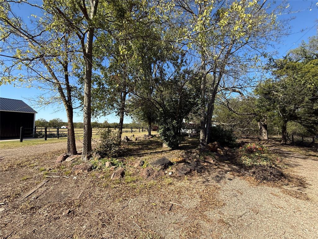 1813 Main Street Sulphur Springs, TX 75482 - Photo 4 of 14 a view of dirt yard with a tree