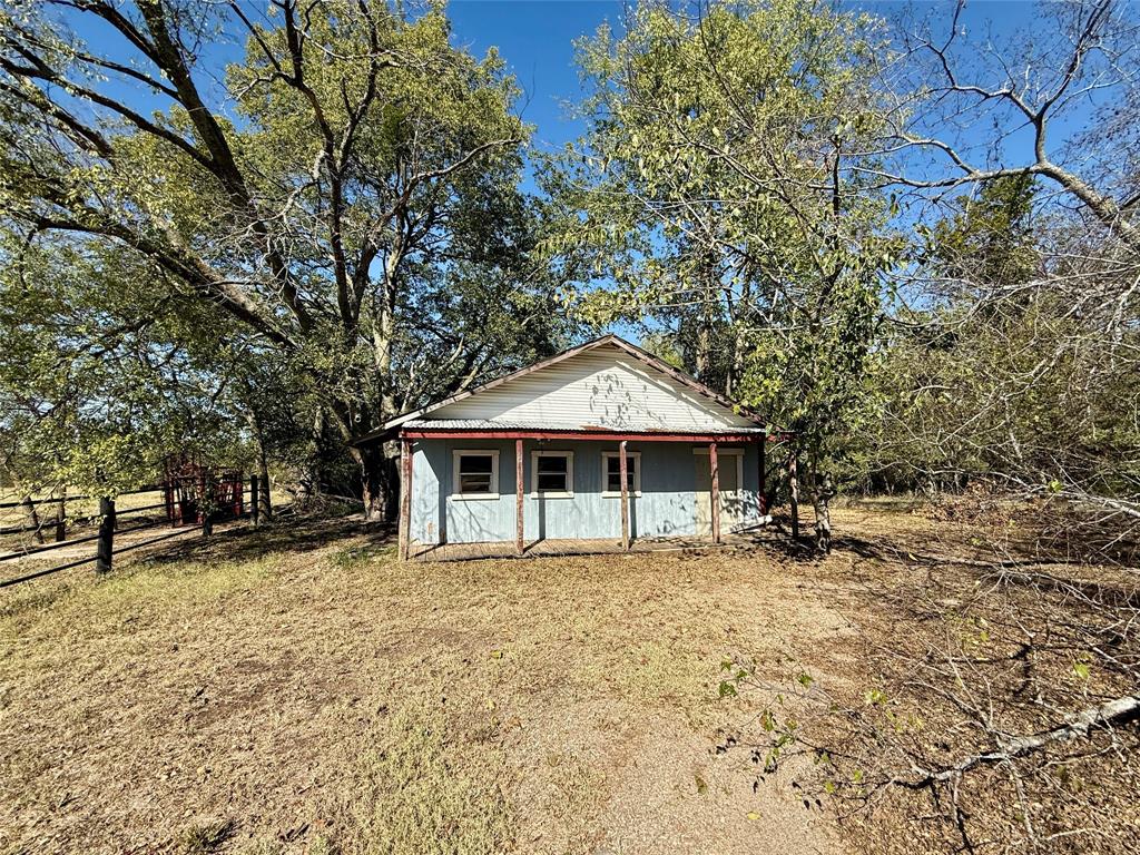 1813 Main Street Sulphur Springs, TX 75482 - Photo 7 of 14 a front view of a house with a yard