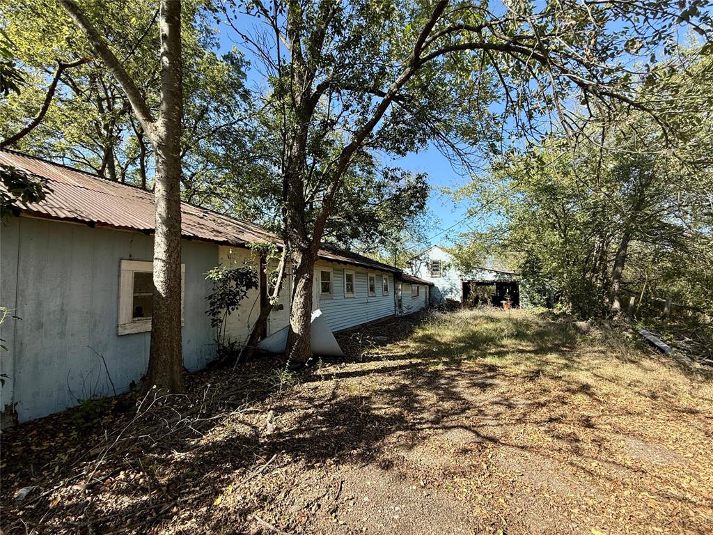 1813 Main Street Sulphur Springs, TX 75482 - Photo 9 of 14 a view of a house with a yard