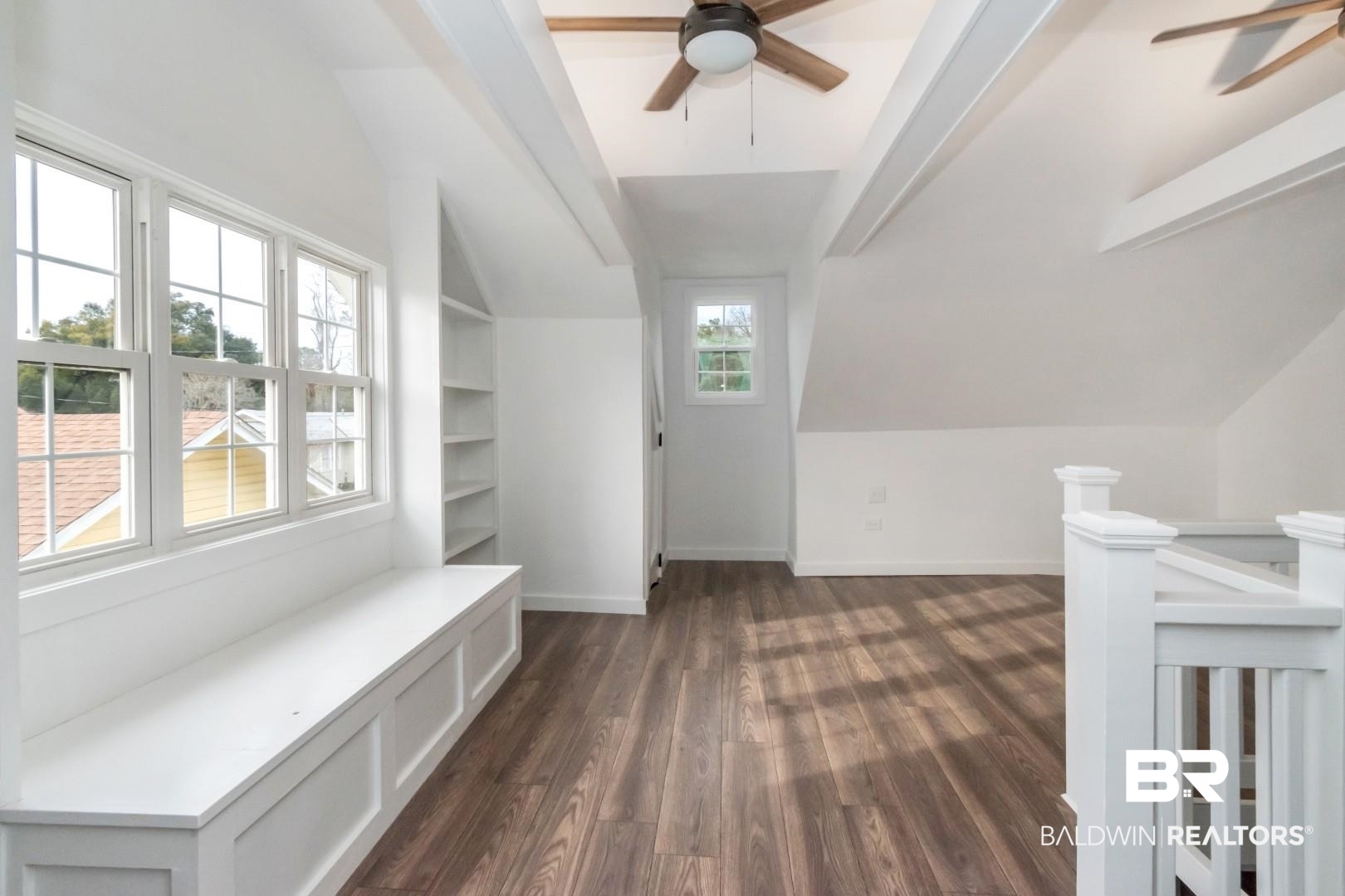 2157 Homewood Street Mobile, AL 36606 - Photo 13 of 36 Bonus room with vaulted ceiling, ceiling fan, dark wood finished floors, and baseboards