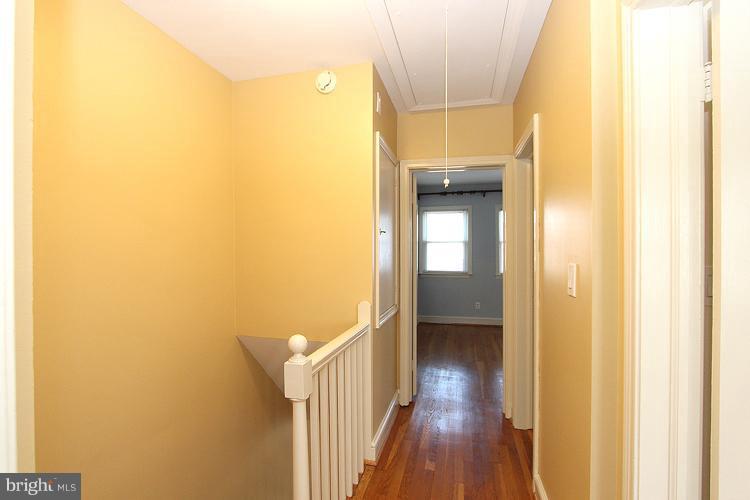 1214 Portner Road Alexandria, VA 22314 - Photo 2 of 21 a view of a hallway with wooden floor